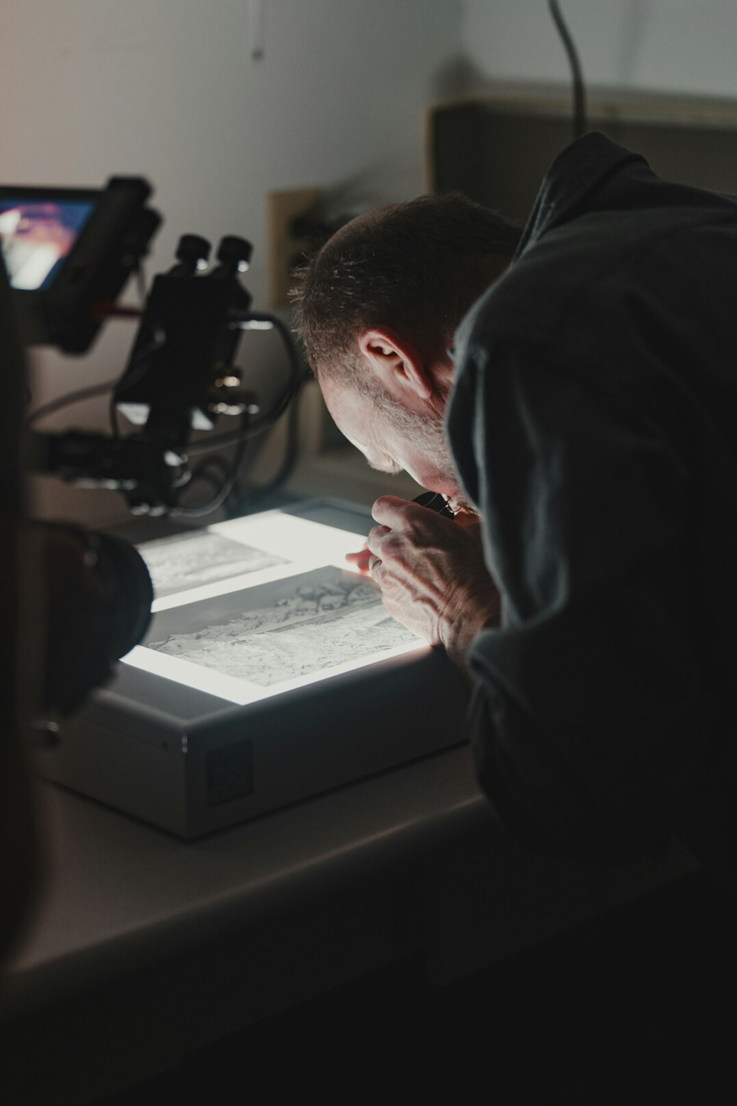 detective examining clues in dim light