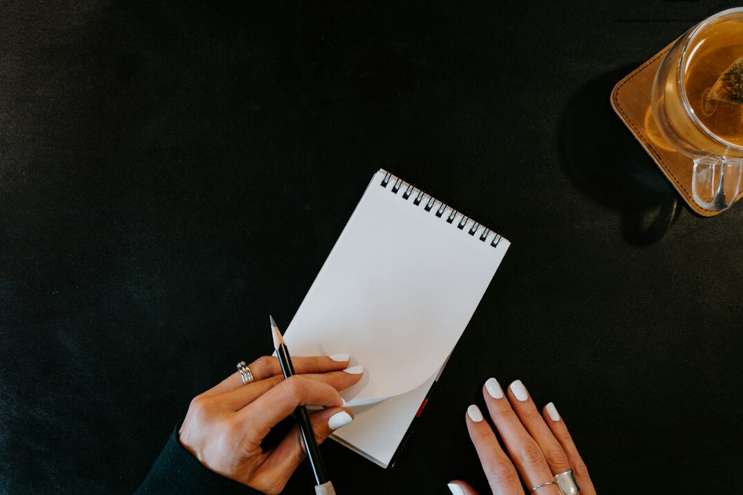 writer at desk with notebook